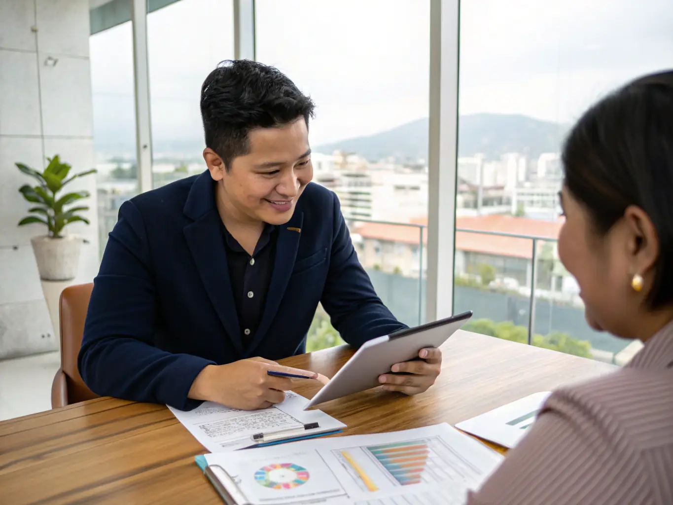 A professional financial advisor discussing wealth plans with a client in an office setting.